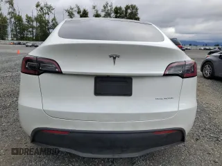 2023 Tesla Model Y Long Range z VIN 7SAYGDEE3PF751019, wystawiony jako Copart lot #57972885 z przebiegiem 24 591 mil mil oraz Szkoda całkowita • Salvage title. Historia ofert i sprzedaży dostępna na DreamBid. Obrazek 6.