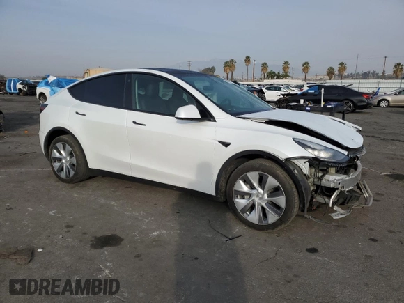 2023 Tesla Model Y Long Range with VIN 7SAYGDEE5PA125887, listed as a Copart auction lot 43188655 with 31,472 mi miles and Salvage Title. Bid and sale history available at DreamBid. Image 4.
