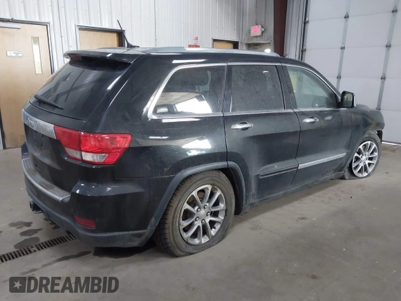 2013 Jeep Grand Cherokee Overland with VIN 1C4RJFCT7DC524005, listed as a IAAI auction lot 42116097 with 126,942 mi miles. Bid and sale history available at carsss.com. Image 4.