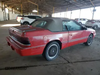 1990 Chrysler LeBaron z VIN 1C3XJ45J9LG405682, wystawiony jako Copart lot #48690985 z przebiegiem 75 714 mil mil oraz Tytuł czysty. Historia ofert i sprzedaży dostępna na DreamBid. Obrazek 3.