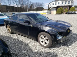 2014 Dodge Charger SE with VIN 2C3CDXBG9EH349301, listed as a Copart auction lot 54000015 with 210,349 mi miles and Clean Title. Bid and sale history available at carsss.com. Image 4.