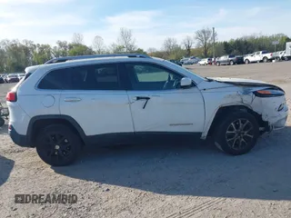 2015 Jeep Cherokee Latitude with VIN 1C4PJLCS6FW689607, listed as a IAAI auction lot 42103286 with 142,479 mi miles. Bid and sale history available at carsss.com. Image 13.