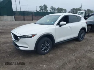 2021 Mazda CX-5 Touring with VIN JM3KFBCM1M1446313, listed as a IAAI auction lot 41930330 with 28,610 mi miles. Bid and sale history available at carsss.com. Image 18.