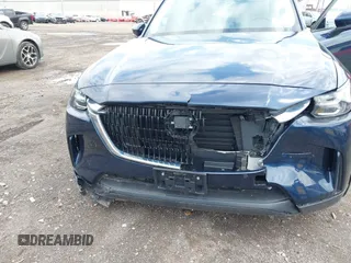 2024 Mazda CX-90 Preferred z VIN JM3KKBHA5R1158229, wystawiony jako IAAI lot #42008464 z przebiegiem 20 817 mil mil oraz . Historia ofert i sprzedaży dostępna na DreamBid. Obrazek 6.
