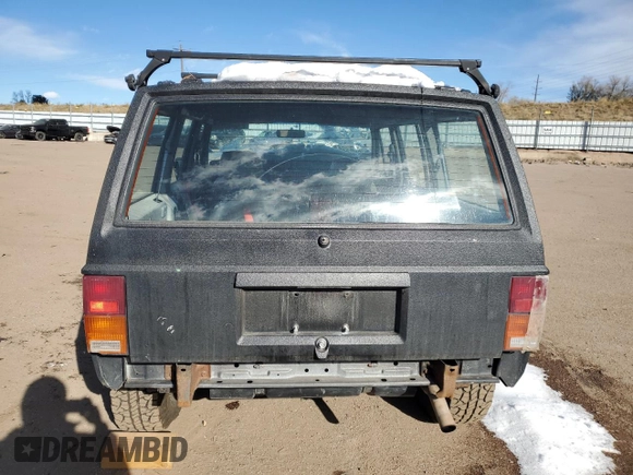 1990 Jeep Cherokee z VIN 1J4FJ28L1LL100736, wystawiony jako Copart lot #81339574 z przebiegiem 160 363 mil mil oraz Czysty tytuł • Clean title. Historia ofert i sprzedaży dostępna na DreamBid. Obrazek 6.