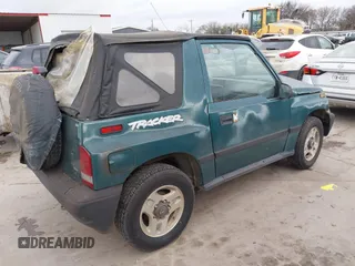 1997 Chevrolet Tracker z VIN 2CNBJ1864V6904934, wystawiony jako IAAI lot #41512446 z przebiegiem 223 032 mil mil oraz . Historia ofert i sprzedaży dostępna na DreamBid. Obrazek 4.