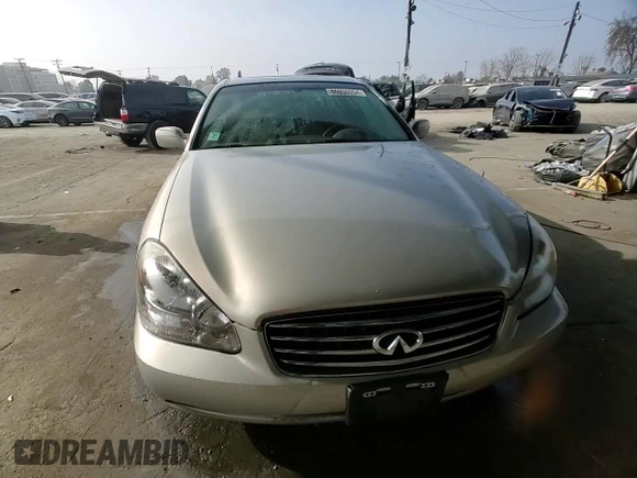 2003 Infiniti Q45 z VIN JNKBF01A03M101890, wystawiony jako Copart lot #86930994 z przebiegiem 158 134 mil mil oraz Szkody całkowita. Historia ofert i sprzedaży dostępna na DreamBid. Obrazek 10.