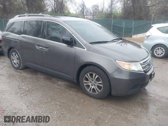 2012 Honda Odyssey EX-L with VIN 5FNRL5H6XCB057557, listed as a IAAI auction lot 42022410 with 174,286 mi miles and . Bid and sale history available at DreamBid. Image 1.