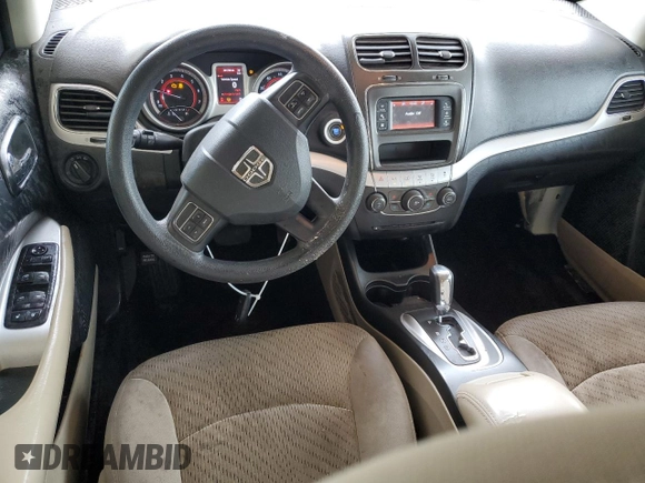 2013 Dodge Journey American Value with VIN 3C4PDCAB5DT656997, listed as a Copart auction lot 57123565 with 201,799 mi miles and Salvage title. Bid and sale history available at DreamBid. Image 8.