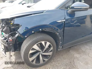 2023 Volkswagen ID.4 Pro z VIN 1V2DNPE8XPC019169, wystawiony jako IAAI lot #41313501 z przebiegiem 32 552 mil mil oraz . Historia ofert i sprzedaży dostępna na DreamBid. Obrazek 6.
