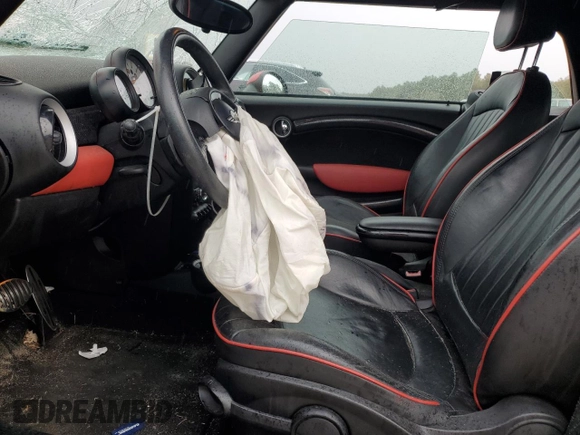 2014 MINI Convertible S with VIN WMWZP3C52ET706143, listed as a Copart auction lot 43184955 with 101,717 mi miles and Salvage title. Bid and sale history available at DreamBid. Image 7.