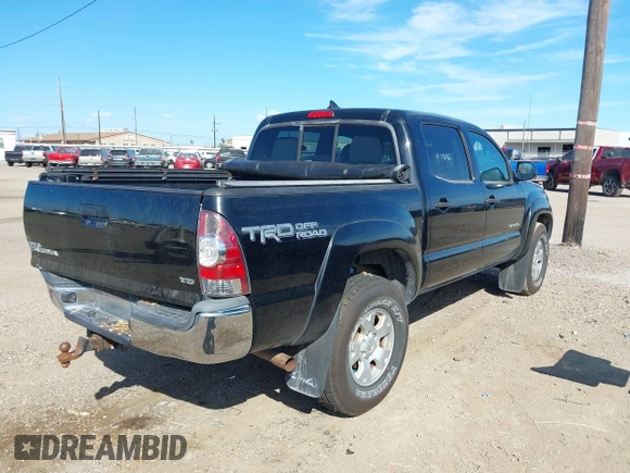 2015 Toyota Tacoma with VIN 3TMLU4EN2FM169326, listed as a IAAI auction lot 40689500 with 77,003 mi miles and . Bid and sale history available at DreamBid. Image 4.