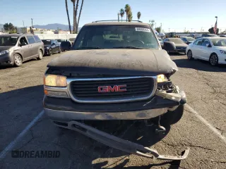 2001 GMC Yukon SLT z VIN 1GKEC13T41J148550, wystawiony jako Copart lot #80580964 z przebiegiem Nie podano mil oraz Szkoda całkowita • Salvage title. Historia ofert i sprzedaży dostępna na DreamBid. Obrazek 5.