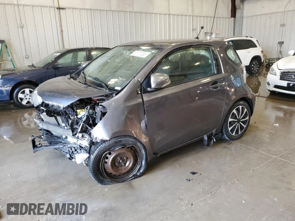 2012 Scion iQ with VIN JTNJJXB07CJ018013, listed as a Copart auction lot 57101085 with 91,370 mi miles and Non repairable. Bid and sale history available at DreamBid. Image 1.