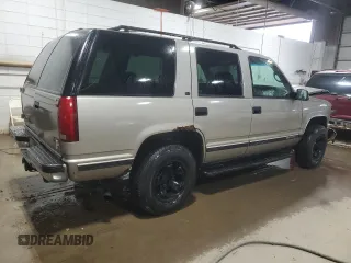 1999 GMC Yukon with VIN 1GKEK13R1XJ740648, listed as a Copart auction lot 82829084 with 211,002 mi miles and Salvage Title. Bid and sale history available at carsss.com. Image 3.