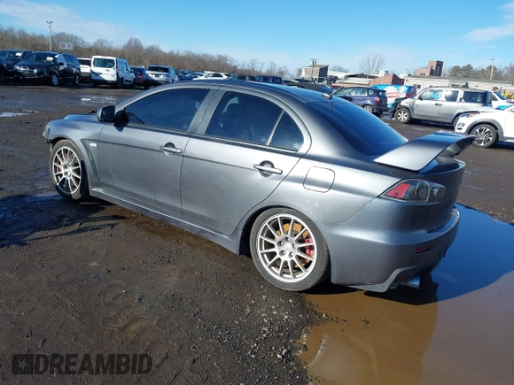 2008 Mitsubishi Lancer Evolution GSR with VIN JA3AW86V18U044077, listed as a IAAI auction lot 41208625 with 157,788 mi miles. Bid and sale history available at carsss.com. Image 3.
