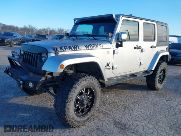 2010 Jeep Wrangler Unlimited Sahara with VIN 1J4BA5H14AL230604, listed as a IAAI auction lot 41884346 with 97,060 mi miles. Bid and sale history available at carsss.com. Image 2.