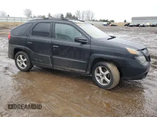 2003 Pontiac Aztek z VIN 3G7DB03E83S580211, wystawiony jako Copart lot #47303045 z przebiegiem Nie podano mil oraz Czysty tytuł • Clean title. Historia ofert i sprzedaży dostępna na DreamBid. Obrazek 4.