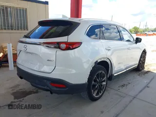 2016 Mazda CX-9 Grand Touring with VIN JM3TCADYXG0113563, listed as a IAAI auction lot 42593120 with 237,696 mi miles and . Bid and sale history available at DreamBid. Image 4.