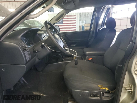 2003 Jeep Grand Cherokee Laredo with VIN 1J4GW48S43C567559, listed as a Copart auction lot 61431595 with 249,998 mi miles and Salvage title. Bid and sale history available at DreamBid. Image 7.