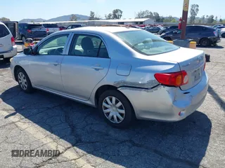 2009 Toyota Corolla with VIN JTDBL40E09J007038, listed as a IAAI auction lot 41830758 with 292,897 mi miles. Bid and sale history available at carsss.com. Image 3.