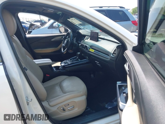 2020 Mazda CX-9 Grand Touring with VIN JM3TCBDY3L0410674, listed as a IAAI auction lot 42389157 with 130,519 mi miles and . Bid and sale history available at DreamBid. Image 5.