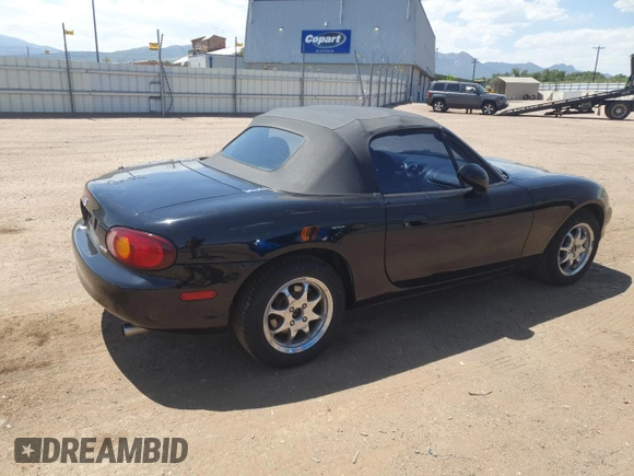 1999 Mazda MX-5 Miata with VIN JM1NB3535X0119662, listed as a Copart auction lot 61870445 with 84,787 mi miles and Clean title. Bid and sale history available at DreamBid. Image 3.