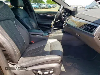 2018 BMW 5 Series M550i xDrive with VIN WBAJB9C54JB286450, listed as a Copart auction lot 61232125 with 88,479 mi miles and Salvage title. Bid and sale history available at DreamBid. Image 7.