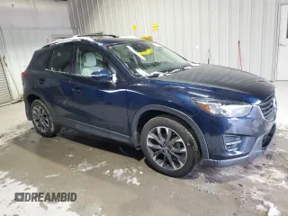 2016 Mazda CX-5 Grand Touring with VIN JM3KE4DY9G0708024, listed as a Copart auction lot 44689995 with 113,002 mi miles and Salvage Title. Bid and sale history available at DreamBid. Image 4.