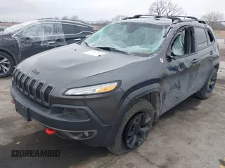 2015 Jeep Cherokee Trailhawk with VIN 1C4PJMBS0FW668730, listed as a IAAI auction lot 41462037 with 83,454 mi miles. Bid and sale history available at carsss.com. Image 17.