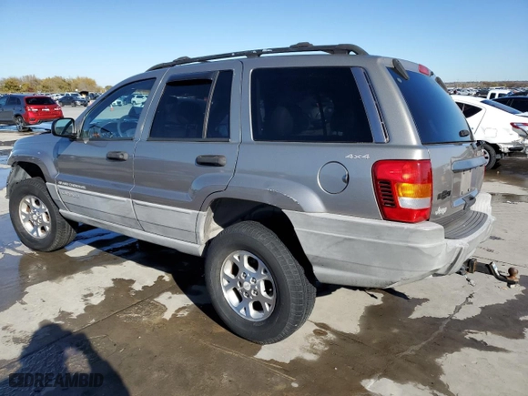 1999 Jeep Grand Cherokee Laredo with VIN 1J4GW58NXXC776438, listed as a Copart auction lot 84412044 with 163,060 mi miles and Salvage Title. Bid and sale history available at carsss.com. Image 2.