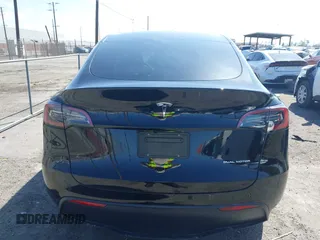 2025 Tesla Model Y Long Range with VIN 7SAYGDEE9SF278607, listed as a IAAI auction lot 41932084 with 9,667 mi miles and . Bid and sale history available at carsss.com. Image 17.