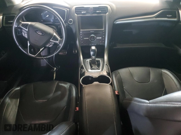 2016 Ford Fusion Titanium z VIN 3FA6P0K96GR117597, wystawiony jako Copart lot #62072525 z przebiegiem Nie podano mil oraz Czysty tytuł • Clean title. Historia ofert i sprzedaży dostępna na DreamBid. Obrazek 8.