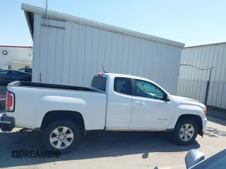 2015 GMC Canyon 2WD SLE z VIN 1GTH5BEA4F1239815, wystawiony jako IAAI lot #42135355 z przebiegiem 110 696 mil mil oraz . Historia ofert i sprzedaży dostępna na DreamBid. Obrazek 14.