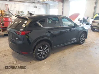 2018 Mazda CX-5 Touring with VIN JM3KFBCM9J0437490, listed as a IAAI auction lot 42006998 with 176,959 mi miles. Bid and sale history available at carsss.com. Image 4.