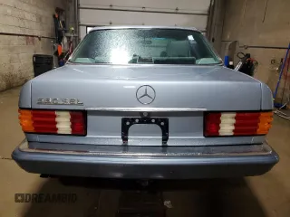 1986 Mercedes-Benz 560 with VIN WDBCA39DXGA213770, listed as a Copart auction lot 49787355 with 218,547 mi miles and Salvage Title. Bid and sale history available at DreamBid. Image 6.