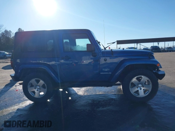 2009 Jeep Wrangler Sahara z VIN 1J4FA54199L722192, wystawiony jako IAAI lot #41619305 z przebiegiem 105 545 mil mil oraz . Historia ofert i sprzedaży dostępna na DreamBid. Obrazek 13.
