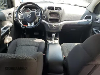 2015 Dodge Journey SXT with VIN 3C4PDCCG4FT697505, listed as a Copart auction lot 64888554 with 191,653 mi miles and Salvage title. Bid and sale history available at DreamBid. Image 8.