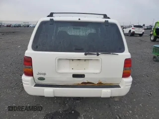 1998 Jeep Grand Cherokee Laredo with VIN 1J4GZ48S1WC165851, listed as a Copart auction lot 84110044 with 306,484 mi miles and Salvage Title. Bid and sale history available at carsss.com. Image 6.