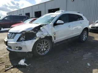 2014 Cadillac SRX Premium Collection z VIN 3GYFNGE31ES615593, wystawiony jako Copart lot #56785775 z przebiegiem 247 230 mil mil oraz Tytuł czysty. Historia ofert i sprzedaży dostępna na DreamBid. Obrazek 1.