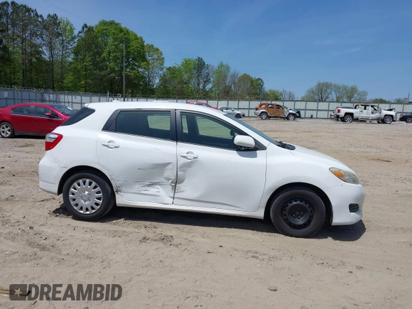 2009 Toyota Matrix with VIN 2T1KU40E39C091087, listed as a IAAI auction lot 42033558 with 338,496 mi miles. Bid and sale history available at carsss.com. Image 6.