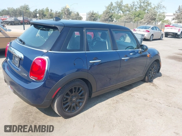 2015 MINI Hardtop 4 Door with VIN WMWXS5C50FT830060, listed as a IAAI auction lot 42744826 with 99,813 mi miles and . Bid and sale history available at DreamBid. Image 4.