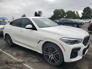 2022 BMW X6 xDrive40i z VIN 5UXCY6C08N9J21980, wystawiony jako Copart lot #48819745 z przebiegiem 24 431 mil mil oraz Szkoda całkowita • Salvage title. Historia ofert i sprzedaży dostępna na DreamBid. Obrazek 4.