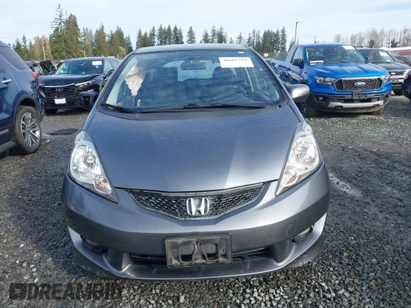 2011 Honda Fit Sport z VIN JHMGE8H54BC000162, wystawiony jako IAAI lot #41665321 z przebiegiem 154 531 mil mil oraz . Historia ofert i sprzedaży dostępna na DreamBid. Obrazek 13.