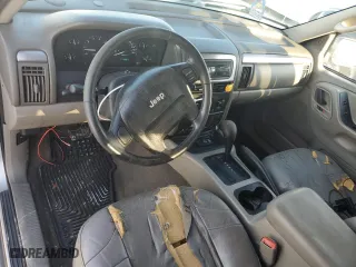 2004 Jeep Grand Cherokee Laredo with VIN 1J4GX48N74C406647, listed as a Copart auction lot 77631654 with 174,824 mi miles and Salvage Title. Bid and sale history available at carsss.com. Image 8.