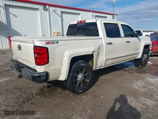2014 Chevrolet Silverado 1500 LTZ with VIN 3GCUKSEC5EG165684, listed as a IAAI auction lot 41114072 with 133,423 mi miles. Bid and sale history available at carsss.com. Image 4.