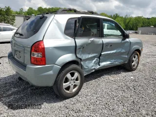 2005 Hyundai Tucson GL with VIN KM8JM12B05U148660, listed as a Copart auction lot 54302805 with 257,233 mi miles and Salvage title. Bid and sale history available at DreamBid. Image 3.