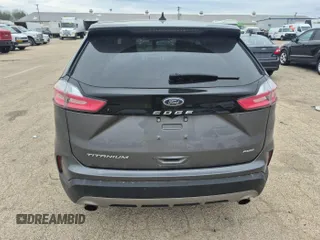 2021 Ford Edge Titanium z VIN 2FMPK4K9XMBA53560, wystawiony jako IAAI lot #42239643 z przebiegiem 93 612 mil mil oraz . Historia ofert i sprzedaży dostępna na DreamBid. Obrazek 1.