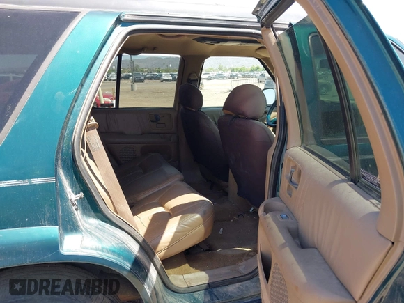 1996 Oldsmobile Bravada z VIN 1GHDT13W5T2711291, wystawiony jako IAAI lot #42502672 z przebiegiem 219 062 mil mil oraz . Historia ofert i sprzedaży dostępna na DreamBid. Obrazek 8.