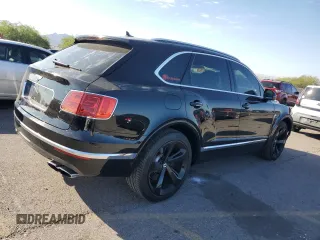 2019 Bentley Bentayga V8 z VIN SJAAM2ZV5KC024154, wystawiony jako Copart lot #74990344 z przebiegiem 41 589 mil mil oraz Szkoda całkowita • Salvage title. Historia ofert i sprzedaży dostępna na DreamBid. Obrazek 3.